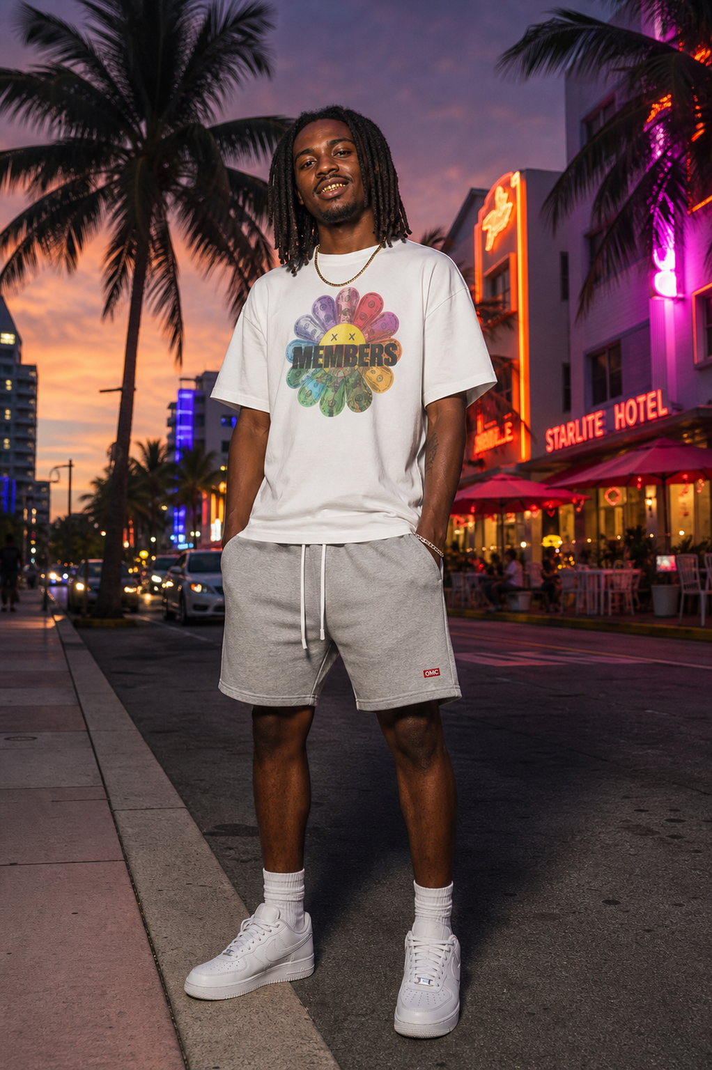 Original Members Miami campaign with model, MEMBERS Flower Tee, and OMC shorts